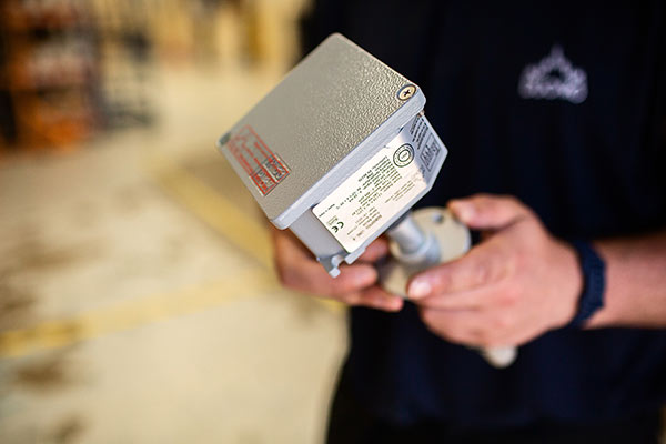 Duomo engineer holding CO100Ar sensor